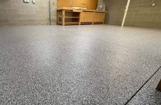Epoxy flake garage flooring installed in Ruskin, FL with a durable, seamless finish for residential and workshop spaces.