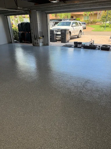 Seamless garage floor coating with decorative epoxy finish installed in Apollo Beach, FL for a durable, stain-resistant surface.